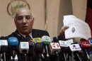 Mohammad Esaaq Aloko, the Attorney General of Afghanistan shows the picture of a suspected insurgent of the Taliban during a news conference in Kabul