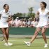 Heather Watson of Britain and her partner Laura Robson of Britain laugh during their women's doubles tennis match against Hsieh Su-Wei of Taiwan and Sabine Lisicki of Germany at the Wimbledon tennis championships in London