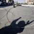 The shadow of an Iraqi gunman is cast on the ground in Baghdad