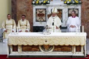 Pope Francis celebrates a mass during his pastoral visit to the Church of S. Maria Regina Pacis in Ostia