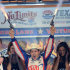 Helio Castroneves, of Brazil, guns loaded with blanks after he won the IndyCar auto race Saturday, June 8, 2013, at Texas Motor Speedway in Fort Worth, Texas. (AP Photo/Larry Papke)