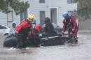 North Carolina emergency services evacuate residents of a neighborhood that fell victim to the flooding caused by Hurricane Matthew in Fayetteville