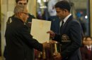 Indian shooter Vijay Kumar (R) receives the Rajiv Gandhi Khel Ratna Award