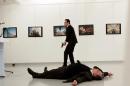 Russian Ambassador to Turkey Andrei Karlov lies on the ground after he was shot by Mevlut Mert Altintas at an art gallery in Ankara