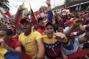 Supporters of Venezuela's President Hugo Chavez shout slogans during a rally in Caracas, Venezuela, Saturday March 10, 2012. Thousands held demonstrations on Saturday to show support for their ailing leader while he recovers from cancer surgery in Cuba. (AP Photo/Fernando Llano)