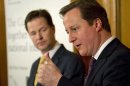 Britain's Prime Minister, David Cameron, accompanied by Deputy Prime Minister, Nick Clegg, speaks at a news conference in 10 Downing Street in central London
