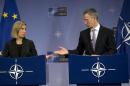 NATO Secretary General Jens Stoltenberg, right, and European Union High Representative Federica Mogherini participate in a media conference after a meeting of NATO foreign ministers at NATO headquarters in Brussels on Tuesday, Dec. 6, 2016. NATO foreign ministers on Tuesday discussed closer EU-NATO cooperation and trans-Atlantic ties. (AP Photo/Virginia Mayo)