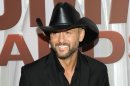 FILE - In this Nov. 9, 2011 file photo, country singer Tim McGraw arrives at the 45th Annual CMA Awards in Nashville, Tenn. McGraw has signed a multi-album deal with Scott Borchetta's Big Machine Records, officially ending his acrimonious relationship with his only previous label, Curb Records. (AP Photo/Evan Agostini, file)