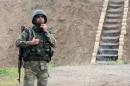 Azeri serviceman stands guard at frontline with self-defense army of Nagorno-Karabakh in Azerbaijan