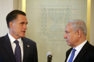 Israeli Prime Minister Benjamin Netanyahu, right, and US Republican presidential candidate Mitt Romney meet at the Prime Minister's office in Jerusalem, Sunday, July 29, 2012. Romney would back an Israeli military strike against Iran aimed at preventing Tehran from obtaining nuclear capability, a top foreign policy adviser said early Sunday, outlining the aggressive posture the Republican presidential candidate will take toward Iran in a speech in Israel later in the day. (AP Photo/Lior Mizrahi, Pool)