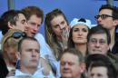 Prince Harry (2nd left) and socialite Cressida Bonas watch the Six Nations International rugby Union match between England and Wales at Twickenham, west London on March 9, 2014