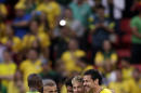 Brazil's Neymar, center, chats with his teammates Fred, right, and Ramires after a 4-1 win over Cameroon during the group A World Cup soccer match between Cameroon and Brazil at the Estadio Nacional in Brasilia, Brazil, Monday, June 23, 2014. (AP Photo/Dolores Ochoa)