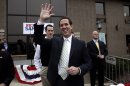 Republican presidential candidate, former Pennsylvania Sen. Rick Santorum waves as he visits the campaign headquarters in Brookfield, Wis., Saturday, March 31, 2012. (AP Photo/Jae C. Hong)