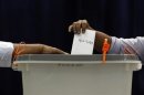 A man casts his vote at a polling centre during the presidential elections in Male