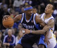 Golden State Warriors' Monta Ellis, right, guards Dallas Mavericks' Jason Terry during the first half of an NBA basketball game Saturday, March 10, 2012, in Oakland, Calif. (AP Photo/Ben Margot)