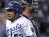 Kansas City Royals' Melky Cabrera runs past Chicago White Sox catcher Tyler Flowers on his solo home run during the first inning of a baseball game Thursday, Sept. 15, 2011, in Kansas City, Mo. (AP Photo/Charlie Riedel)