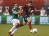 U.S. midfielder Robbie Rogers is pulled down by Mexico defender Gerardo Torrado during the second half of their friendly soccer match in Philadelphia