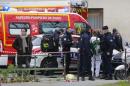 A view shows policemen and rescue members at the scene after a shooting at the Paris offices of Charlie Hebdo, a satirical newspaper,