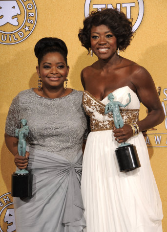 Octavia Spencer, winner of award for outstanding performance by a female actor in a supporting role for "The Help," left, and Viola Davis, winner of the award for outstanding performance by a female actor in a leading role for "The Help," pose backstage at the 18th Annual Screen Actors Guild Awards on Sunday Jan. 29, 2012 in Los Angeles. (AP Photo/Chris Pizzello)