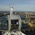 Torch bearer Amelia Hempleman-Adams, age 17, stands on top of a capsule on the London Eye as part of the torch relay ahead of the London 2012 Olympic Games in London