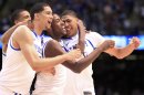 Kentucky Wildcats' Davis, Kidd-Gilchrist and Vargas celebrate after the Wildcats defeated the Kansas Jayhawks in the men's NCAA Final Four championship college basketball game in New Orleans