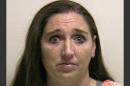 This photo provided by the Utah County jail shows Megan Huntsman, who was booked into the Utah County jail on suspicion of killing six of her newborn children over the past decade. Seven dead babies were found in a garage at a Pleasant Grove home where Huntsman lived up until 2011. (AP Photo/Utah County Jail) Courtesy Utah County Jail