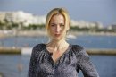 Actress Anderson poses during a photocall for the television series "The Fall" during the annual MIPCOM television programme market in Cannes