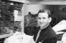 In this 1957 photo provided courtesy of the Bernard J. Lansky Collection, clothier Bernard Lansky displays a jacket in his high-fashion store in Memphis, Tenn. Lansky, known as the clothier to rock and roll icon Elvis Presley, died Thursday, Nov. 15, 2012 at age 85 in Memphis. (AP Photo/Courtesy of the Bernard J. Lansky Collection) MANDATORY CREDIT