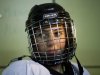 In this photo taken Monday, Feb. 27, 2012, Druse Arab Maya al-Yousef, 13, a member of the Canada-Israel Hockey School wears her helmet prior to an ice-hockey training session in the village of Metulla on the border between Israel and Lebanon. A rare Arab-Jewish ice hockey team in Israel is breaking all kinds of ice, overcoming barriers of language, culture and conflict to play against a common enemy: other teams. (AP Photo/Ariel Schalit)
