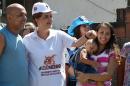 Brazilian President Dilma Rousseff (C) takes part in an awareness campaign about Zika, in the neighbourhood of Santa Cruz in Rio de Janeiro, on February 13, 2016
