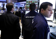 <p>               In this Feb. 21, 2012 photo, traders work on the floor at the New York Stock Exchange. Markets were subdued Thursday, Feb. 23, 2012, as Greece pressed ahead with reforms demanded by its creditors in exchange for crucial bailout cash and as tensions rose in the Persian Gulf over Iran's nuclear program.  (AP Photo/Seth Wenig)