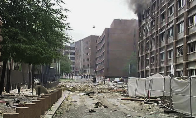 In this video image taken from television, smoke is seen billowing from a damaged building as debris is strewn across the street after an explosion in Oslo, Norway Friday July 22, 2011. A loud explosion shattered windows Friday at the government headquarters in Oslo which includes the prime minister's office, injuring several people. Prime Minister Jens Stoltenberg is safe, government spokeswoman Camilla Ryste told The Associated Press. (AP Photo/TV2 NORWAY via APTN) NORWAY OUT