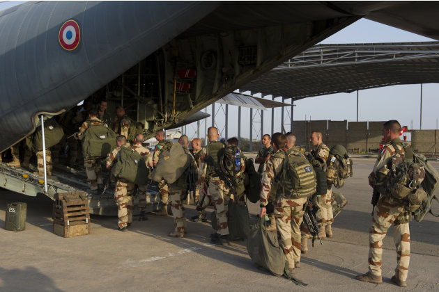 This picture released by the French Army Communications Audiovisual office (ECPAD) shows French soldiers of the 21st Marine Infantry Regiment boarding to Bamako, the capital from Mali, at the N'Djamen