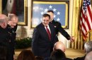 Retiring U.S. Defense Secretary Panetta arrives to attend a ceremony where President Obama presents the Medal of Honor to former active duty Army Staff Sergeant Romesha in the East Room of the White House in Washington