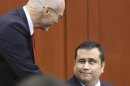 George Zimmerman is greeted by defense counsel Don West at the start of his trial in Seminole circuit court in Sanford