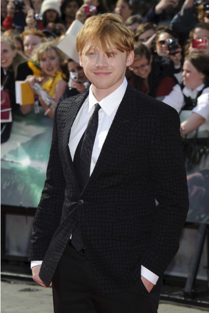 British actor Rupert Grint arrives in Trafalgar Square, central London, for the world premiere of Harry Potter and The Deathly Hallows: Part 2, the last film in the series, Thursday, July 7, 2011. (AP