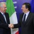 European Commission President Jose Manuel Barroso, right, welcomes Italy's Prime Minister Mario Monti, at the European Commission headquarters in Brussels, Friday, April 27, 2012. (AP Photo/Yves Logghe)