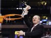 Ohio State head coach Thad Matta celebrates as he cuts down the net after his team defeated Syracuse 77-70 in the East Regional final game in the NCAA men's college basketball tournament, Saturday, March 24, 2012, in Boston. (AP Photo/Elise Amendola)