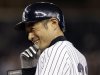 New York Yankees Ichiro Suzuki smiles at first base after driving in the winning run against the Toronto Blue Jays in the eighth-inning of the Yankees' 2-1 victory in Game 2 of a baseball doubleheader at Yankee Stadium in New York, Wednesday, Sept. 19, 2012. (AP Photo/Kathy Willens)