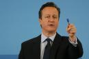 Britain's Prime Minister David Cameron gestures as he delivers a speech in Hastings