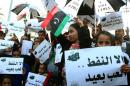 Libyan protesters chant slogans demanding the lifting of a months-long blockade by armed protesters of vital oil terminals, in Martyrs' Square in the capital Tripoli, on December 13, 2013