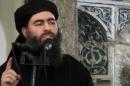 FILE - This file image made from video posted on a militant website Saturday, July 5, 2014, which has been authenticated based on its contents and other AP reporting, purports to show the leader of the Islamic State group, Abu Bakr al-Baghdadi, delivering a sermon at a mosque in Iraq. The leader of the Islamic State group said it will fight to the last man, in a strident audio recording released on social media networks Thursday, Nov. 13, that was his first public statement since a U.S.-led alliance launched airstrikes against his fighters in Iraq and Syria. (AP Photo/Militant video, File)