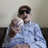 Cuban former pitcher Conrado Marrero, who once played with the Washington Senators, holds a ball as he poses for pictures during an interview in Havana, Cuba, Wednesday, April 25, 2012. Marrero, who last year became the oldest living former big leaguer, turned 101 on Wednesday. (AP Photo/Franklin Reyes)