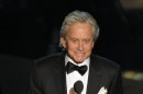 Michael Douglas presents an award during the 84th Academy Awards on Sunday, Feb. 26, 2012, in the Hollywood section of Los Angeles. (AP Photo/Mark J. Terrill)