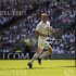England's Ashton runs to score a try against Barbarians during their rugby union match in London