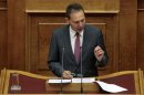Greece's Finance Minister Stournaras addresses parliamentarians during a session at the parliament in Athens