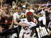 Maryland defensive back Anthony Green, center, celebrates with fans after Maryland's 32-24 win over Miami in an NCAA college football game in College Park, Md., Monday, Sept. 5, 2011. (AP Photo/Patrick Semansky)