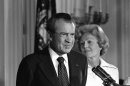 FILE - In this Aug. 9, 1974 black-and-white file photo, President Richard M. Nixon and his wife Pat Nixon are shown standing together in the East Room of the White House in Washington. Thirty-six years after Nixon testified secretly to a grand jury investigating Watergate, a federal judge orders the first public release of the transcript. (AP Photo/Charlie Harrity, File)