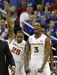 Iowa State forward Melvin Ejim (3) and guard Tyrus McGee (25) react after a 3-pointer against Connecticut in the first half of their NCAA tournament second-round college basketball game in Louisville, Ky., Thursday, March 15, 2012. (AP Photo/John Bazemore)