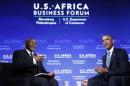 U.S. President Barack Obama answers questions from Takunda Ralph Michael Chingonzo of Zimbabwe at the U.S.-Africa Business Forum about strengthening trade and financial ties between the U.S. and Africa while in Washington